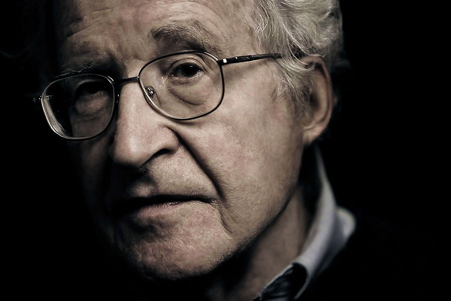 Explore how Noam Chomsky dissects principles and policies that led to the unequal distribution of wealth and power in the American society.